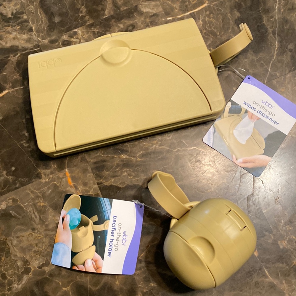 Ubbi on-the-go wipes dispenser & pacifier holder. Holds 2 pacifiers.